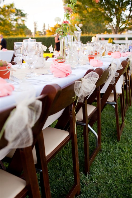 long reception table with flowers by by Anastasia Ehlers | photo by Erika Nicole