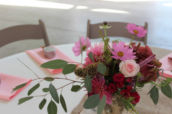 pink centerpiece with eucalyptus