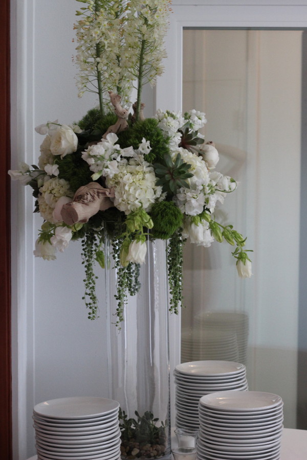 tall green and white centerpiece by anastasia floral