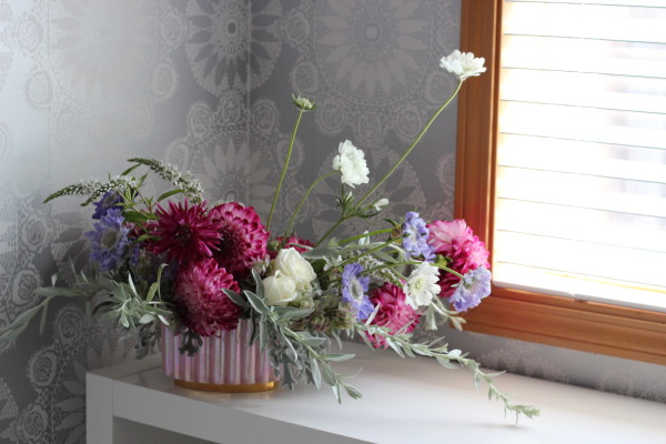 Pink and purple dahlia, scabiosa, and rose arrangement  by Anastasia Ehlers