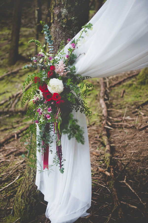 chiffon wedding altar with floral tieback by Anastasia Floral | photo by Cat Dossett