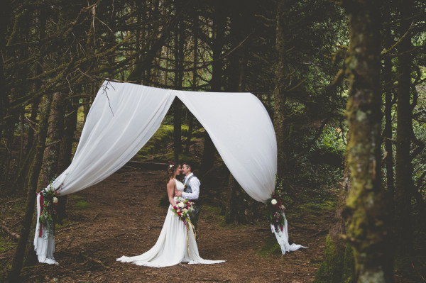 fabric draped altar in the woods | flowers by Anastasia Floral | photo by Cat Dossett